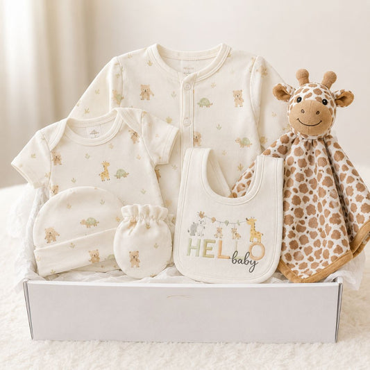 Neutral baby gift box containing baby clothing bib and giraffe comforter