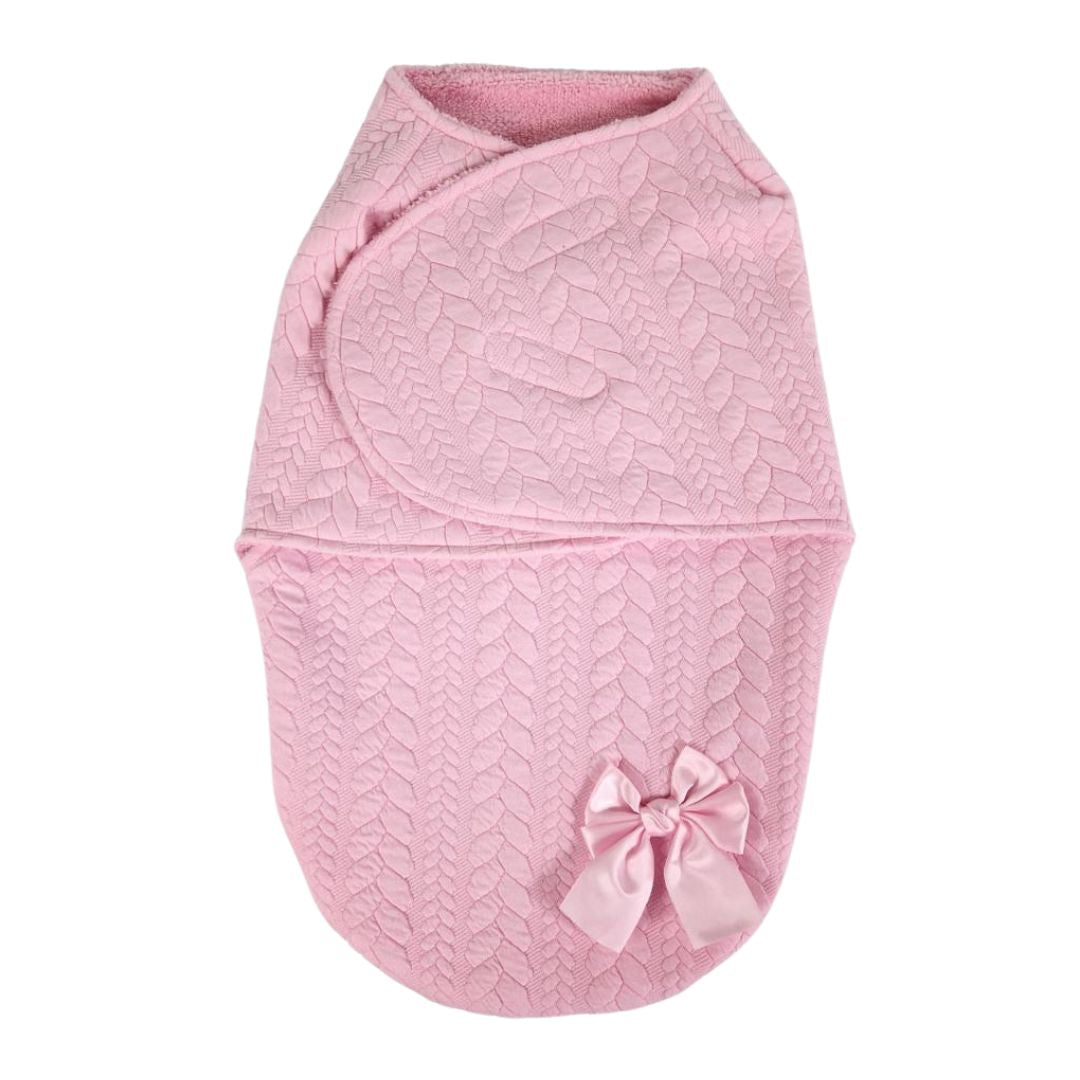 Pink baby swaddle with a bow on.