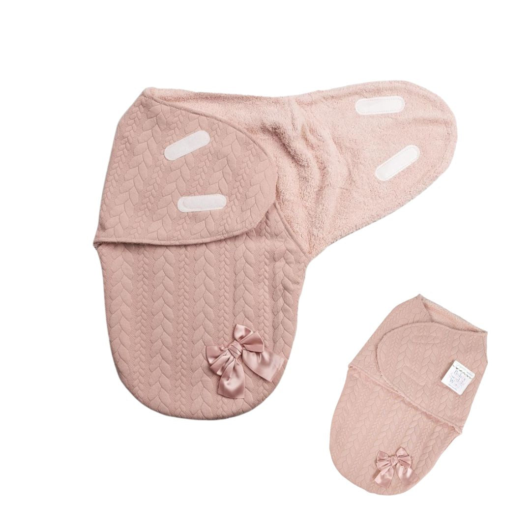 Pink baby booties with bow.