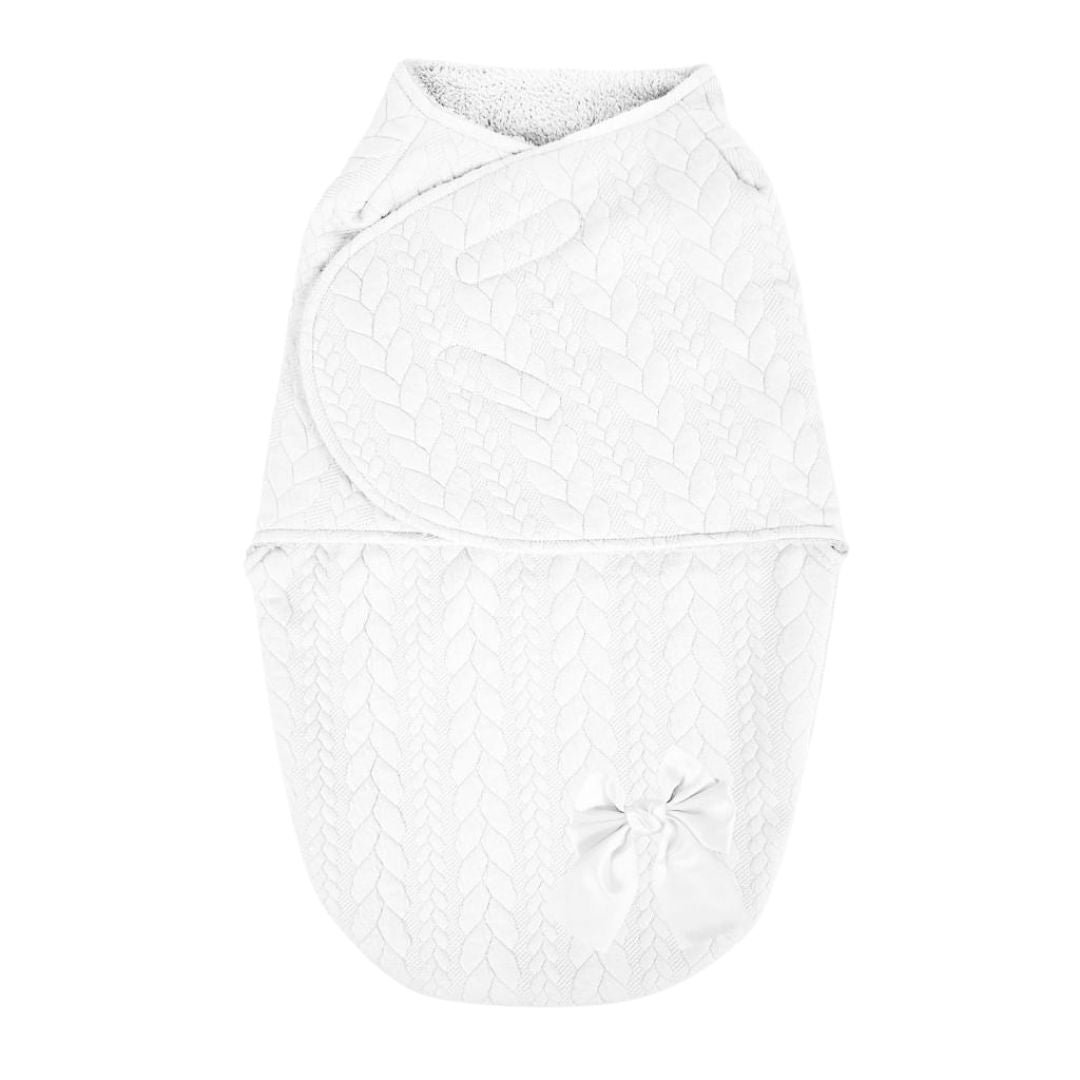 White baby swaddle with a bow.